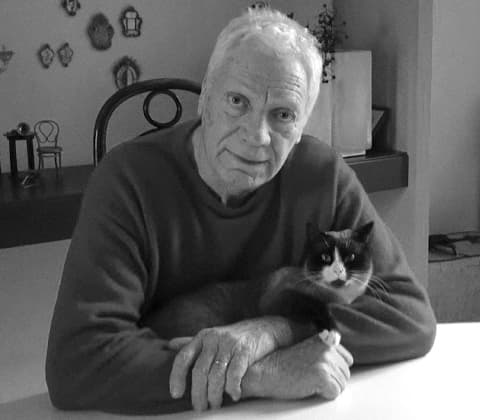A portrait of Carlo Nason and his cat